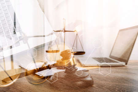 Male lawyer working with contract papers and wooden gavel on tabel in courtroom. justice and law...