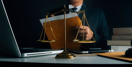 Justice and law concept.Male judge in a courtroom with the gavel, working with, computer and docking...