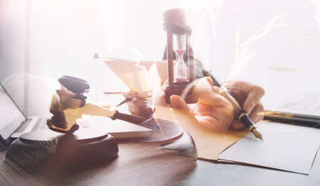 Business and lawyers discussing contract papers with brass scale on desk in office. Law, legal...