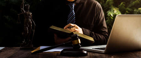 Business and lawyers discussing contract papers with brass scale on desk in office. Law, legal...