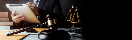 justice and law concept.Male judge in a courtroom on wooden table and Counselor or Male lawyer...