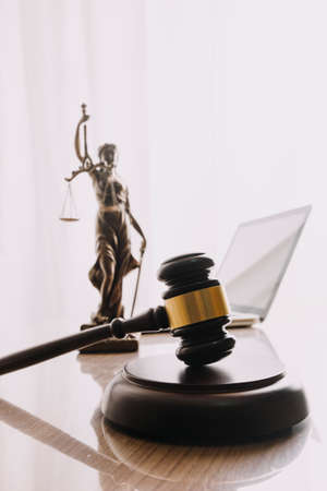 Business and lawyers discussing contract papers with brass scale on desk in office. Law, legal...
