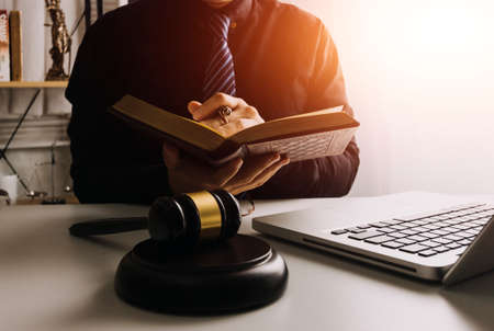 Business and lawyers discussing contract papers with brass scale on desk in office. Law, legal...