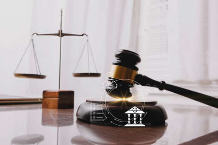 Business and lawyers discussing contract papers with brass scale on desk in office. Law, legal...