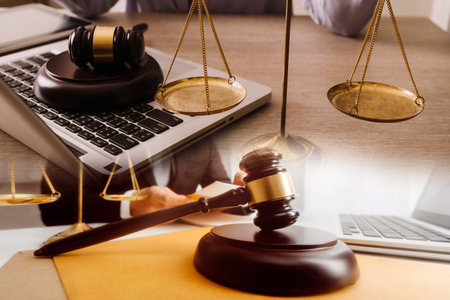 Male lawyer working with contract papers and wooden gavel on tabel in courtroom. justice and law...