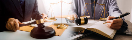 Justice and law concept. Gavel on sounding block in hand's Male judge at a courtroom, working with...