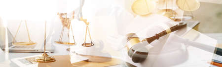 Justice and law concept. Gavel on sounding block in hand's Male judge at a courtroom, working with...