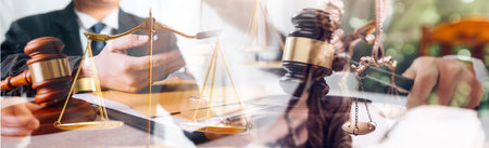 Justice and law concept. Gavel on sounding block in hand's Male judge at a courtroom, working with...
