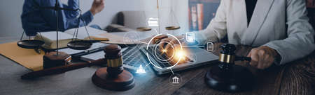 Justice and law concept. Gavel on sounding block in hand's Male judge at a courtroom, working with...