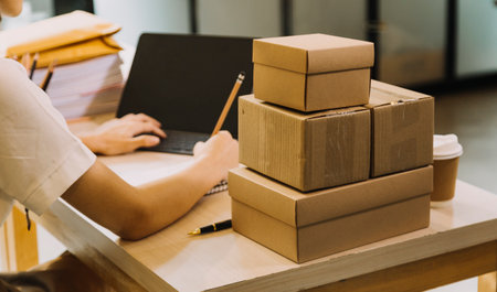 Portrait of Starting small businesses SME owners, two Asian woman check online orders Selling...