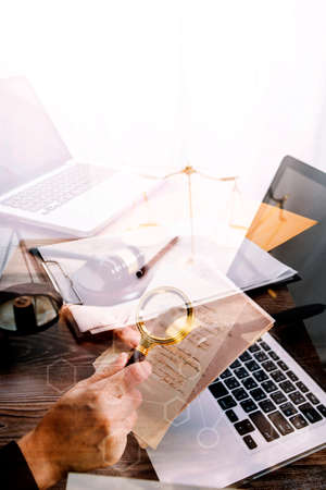 Business and lawyers discussing contract papers with brass scale on desk in office. Law, legal...