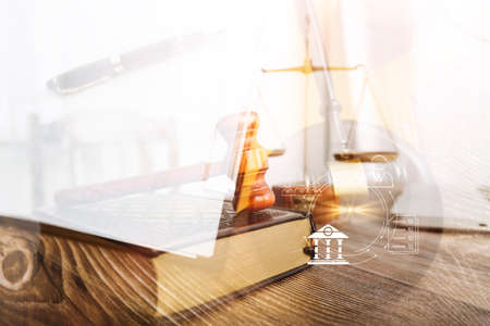 Business and lawyers discussing contract papers with brass scale on desk in office. Law, legal services, advice, justice and law concept picture with film grain effectの写真素材