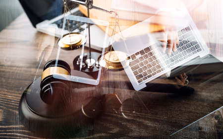 Business and lawyers discussing contract papers with brass scale on desk in office. Law, legal...