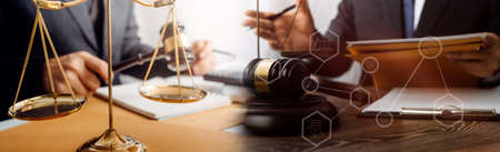 Business and lawyers discussing contract papers with brass scale on desk in office. Law, legal...