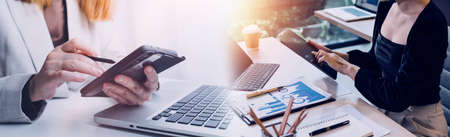 Business team finance or bookkeeper working with a calculator to calculate business data summary...