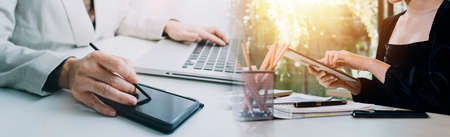 Business team finance or bookkeeper working with a calculator to calculate business data summary...