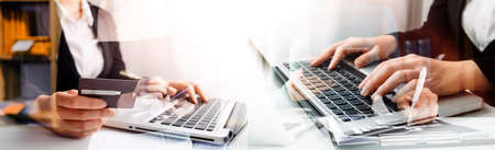 Business team finance or bookkeeper working with a calculator to calculate business data summary...