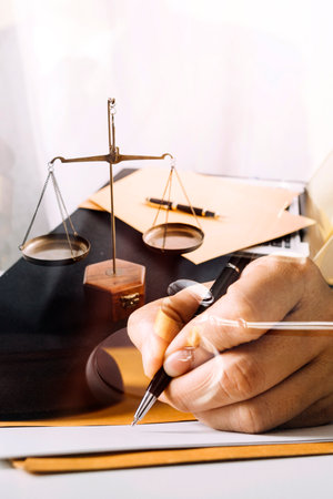 justice and law concept.Male judge in a courtroom on wooden table and Counselor or Male lawyer...