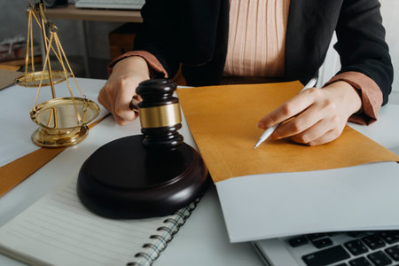 justice and law concept.Male judge in a courtroom on wooden table and Counselor or Male lawyer...