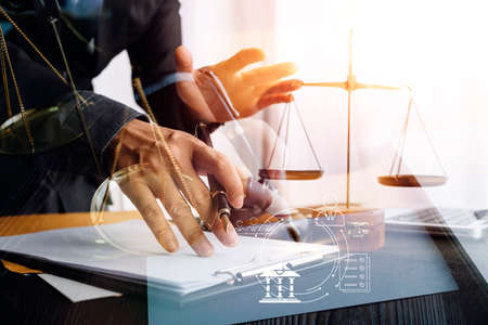 justice and law concept.Male judge in a courtroom on wooden table and Counselor or Male lawyer...