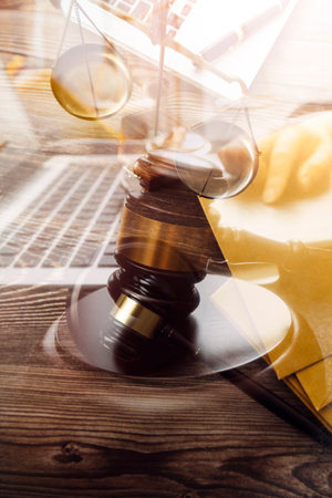Business and lawyers discussing contract papers with brass scale on desk in office. Law, legal...