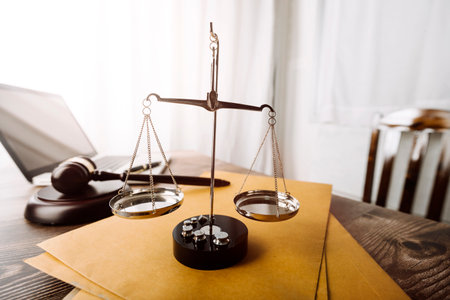 justice and law concept.Male judge in a courtroom on wooden table and Counselor or Male lawyer...