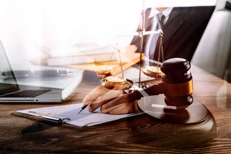 justice and law concept.Male judge in a courtroom on wooden table and Counselor or Male lawyer...