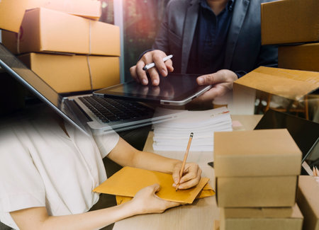 Portrait of Starting small businesses SME owners, two Asian woman check online orders Selling...