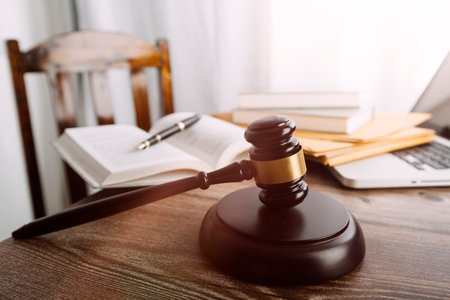justice and law concept.Male judge in a courtroom on wooden table and Counselor or Male lawyer...