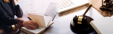 Business and lawyers discussing contract papers with brass scale on desk in office. Law, legal...