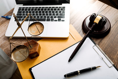 Business and lawyers discussing contract papers with brass scale on desk in office. Law, legal...