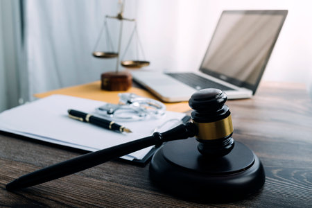 Business and lawyers discussing contract papers with brass scale on desk in office. Law, legal...