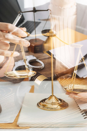 Justice and law concept.Male judge in a courtroom with the gavel, working with, computer and docking...