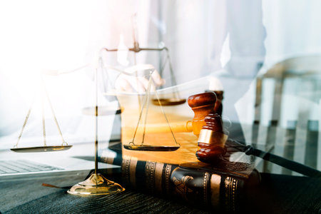 Justice and law concept.Male judge in a courtroom with the gavel, working with, computer and docking...