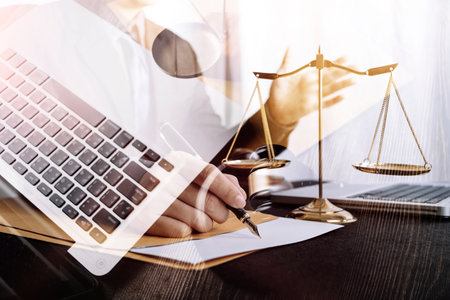 Business and lawyers discussing contract papers with brass scale on desk in office. Law, legal...