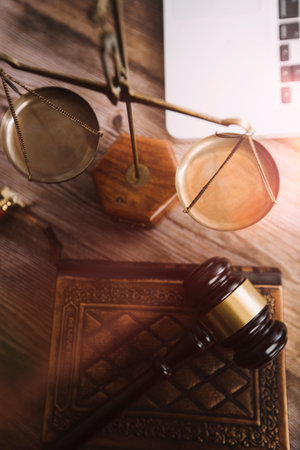 Justice and law concept.Male judge in a courtroom with the gavel, working with, computer and docking...