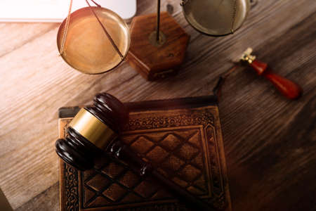 Justice and law concept.Male judge in a courtroom with the gavel, working with, computer and docking...
