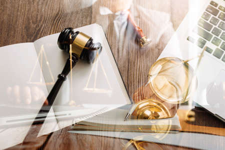 Business and lawyers discussing contract papers with brass scale on desk in office. Law, legal...