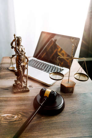 justice and law concept.Male judge in a courtroom on wooden table and Counselor or Male lawyer...