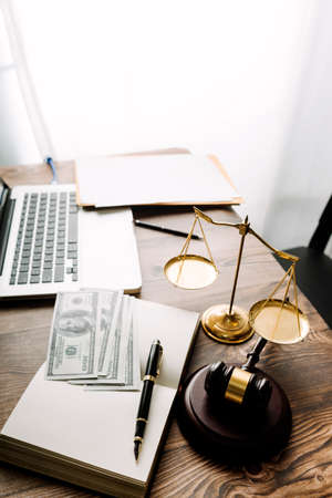 Justice and law concept.Male judge in a courtroom with the gavel, working with, computer and docking...