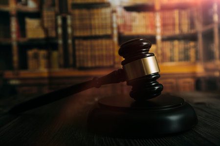 Justice and law concept.Male judge in a courtroom with the gavel, working with, computer and docking...