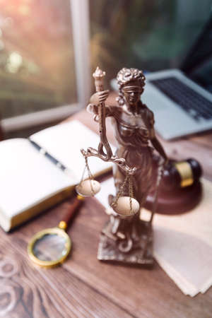 Justice and law concept.Male judge in a courtroom with the gavel, working with, computer and docking...