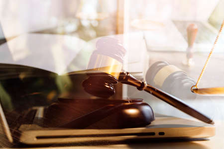 Business and lawyers discussing contract papers with brass scale on desk in office. Law, legal...