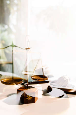 Business and lawyers discussing contract papers with brass scale on desk in office. Law, legal...