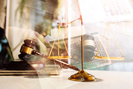 Business and lawyers discussing contract papers with brass scale on desk in office. Law, legal...