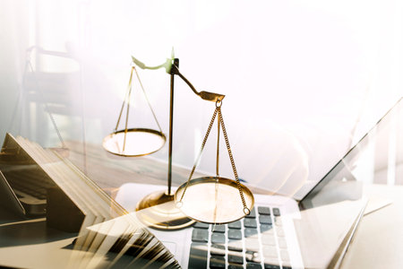 Business and lawyers discussing contract papers with brass scale on desk in office. Law, legal...