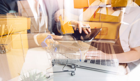 Portrait of Starting small businesses SME owners, two Asian woman check online orders Selling...