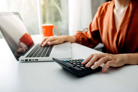 Business accounting concept, Business man using calculator with computer laptop, budget and loan...