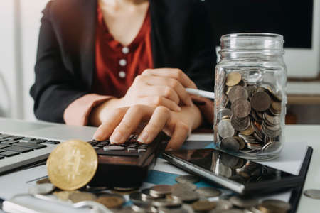 Business accounting concept, Business man using calculator with computer laptop, budget and loan...