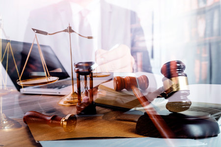 Justice and law concept.Male judge in a courtroom with the gavel, working with, computer and docking...